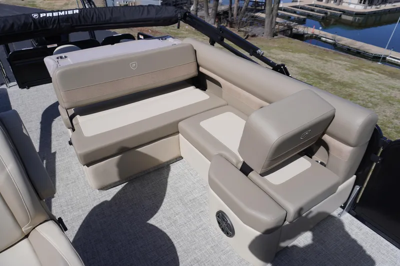 Slide: The Image of Premier 250 Sunsation RS 2025 boat interior with beige seating and speaker. - 13