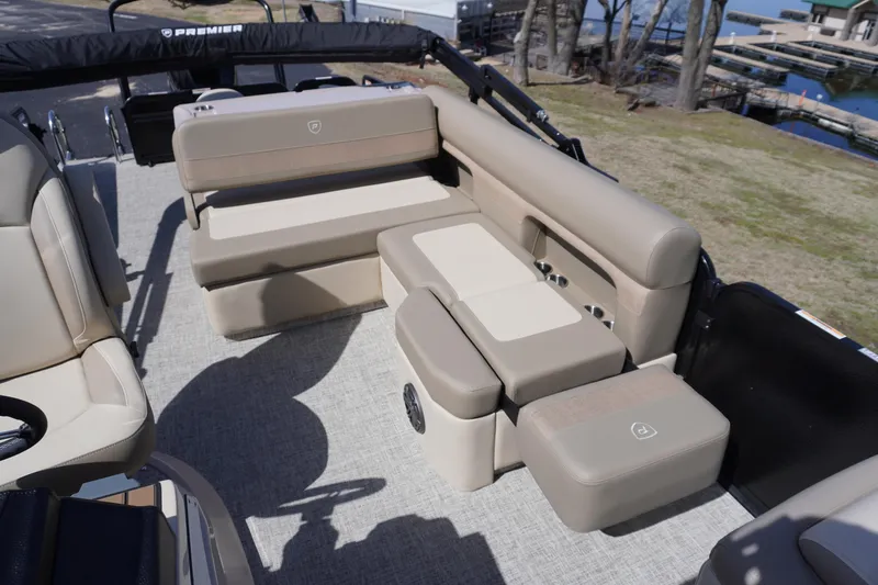 Slide: The Image of 2025 Premier 250 Sunsation RS boat interior with beige seating and spacious layout. - 14