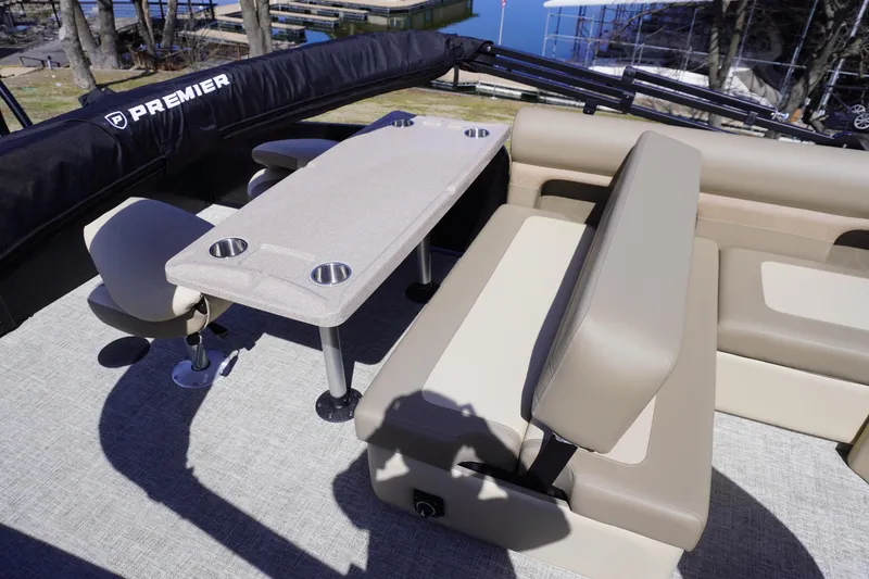 Slide: The Image of Premier 250 Sunsation RS 2025 boat interior with beige seating and table. - 15