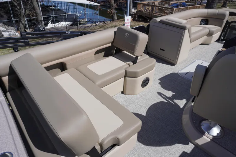 Slide: The Image of Luxurious seating on 2025 Premier 250 Sunsation RS pontoon boat, featuring beige upholstery. - 16