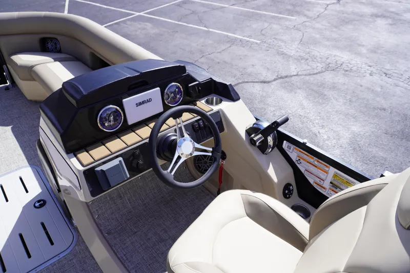 Slide: The Image of 2025 Premier 250 Sunsation RS boat dashboard with steering wheel and controls. - 17