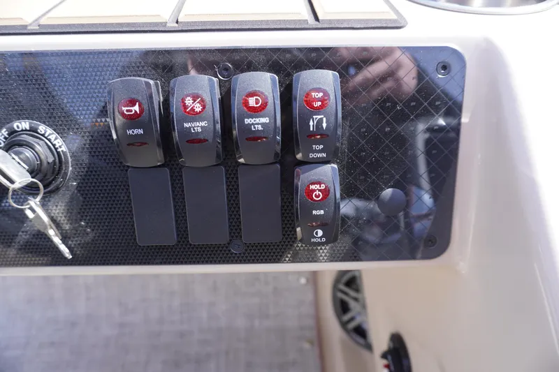 Slide: The Image of Control panel of 2025 Premier 250 Sunsation RS boat with labeled switches. - 18