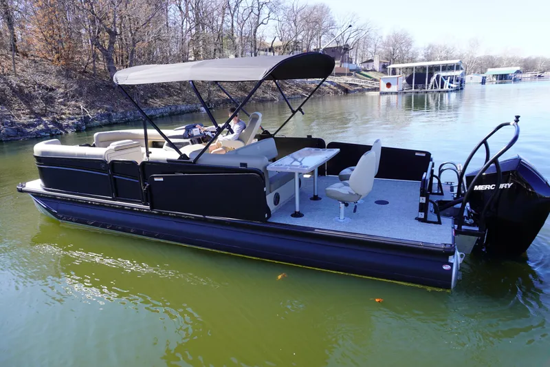 Slide: The Image of 2025 Premier 250 Sunsation RS pontoon boat on a calm lake. - 4
