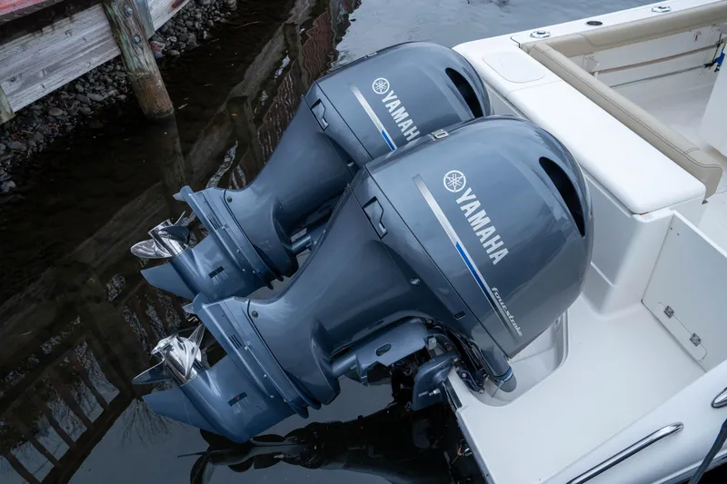 Slide: The Image of Twin Yamaha outboard engines on a 2018 Pursuit C 260 Center Console boat. - 10