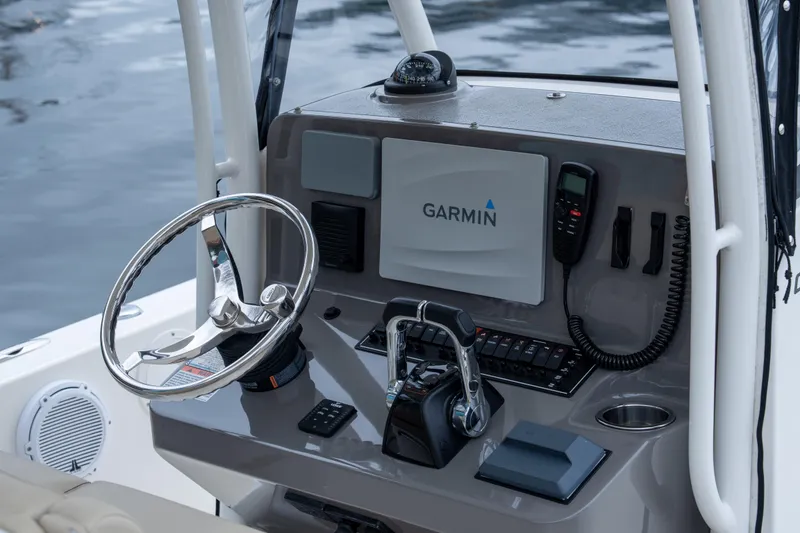 Slide: The Image of 2018 Pursuit C 260 Center Console helm with Garmin navigation system. - 14