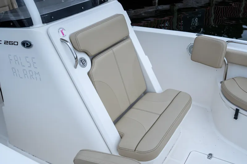 Slide: The Image of 2018 Pursuit C 260 Center Console boat seat with beige upholstery. - 15