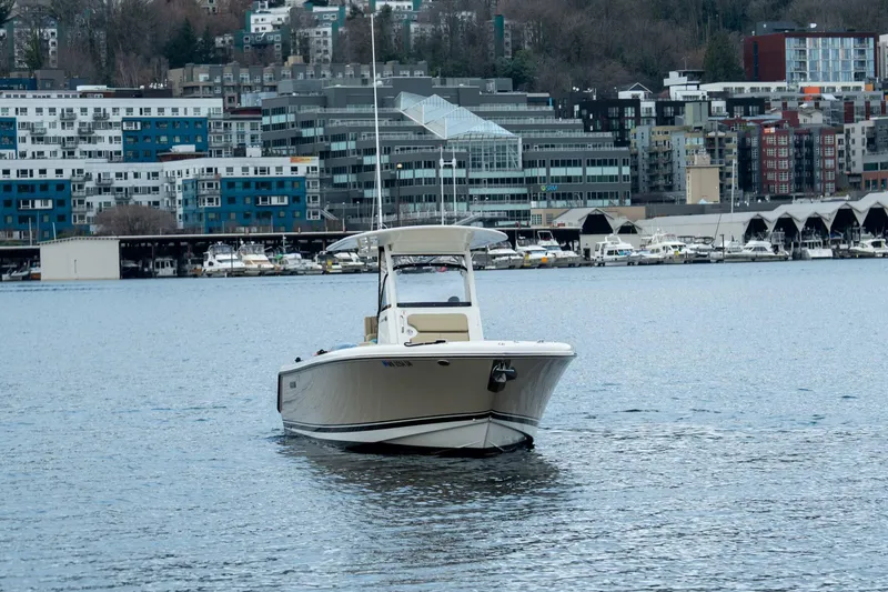 Slide: The Image of 2018 Pursuit C 260 Center Console boat on urban waterfront. - 6