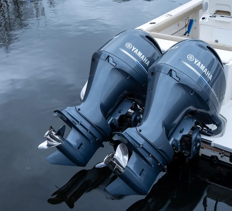 Slide: The Image of Twin Yamaha outboard motors on a 2018 Pursuit C 260 Center Console boat. - 9