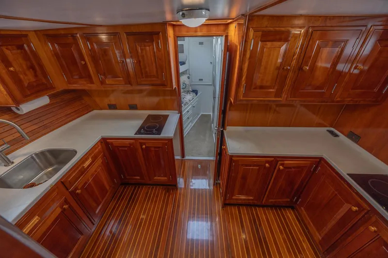 Slide: The Image of Luxurious wooden kitchen interior on a 1964 Huckins Atlantic yacht. - 48