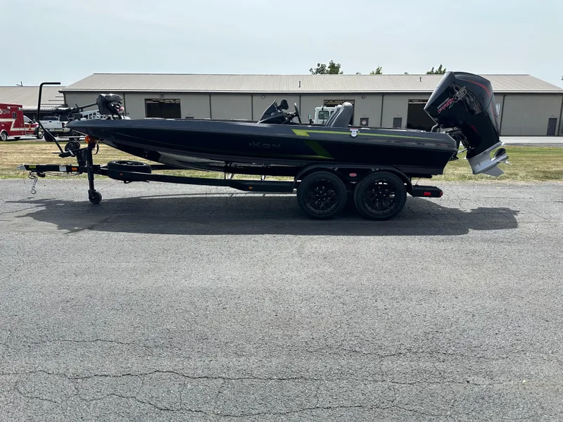 Slide: The Image of 2025 iKon VLX20 boat on trailer, parked outdoors, side view. - 1
