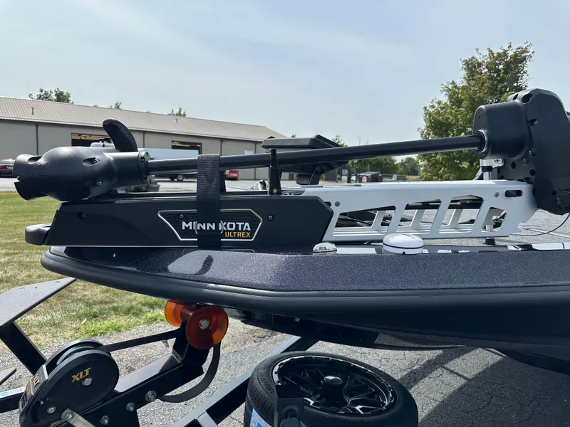 Slide: The Image of Minn Kota Ultrex motor on iKon VLX20 boat, 2025 model, parked outdoors. - 16