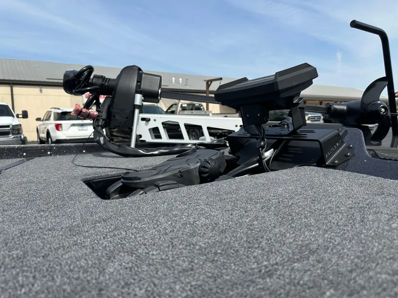 Slide: The Image of iKon VLX20 2025 boat dashboard with advanced navigation equipment, parked outdoors. - 18