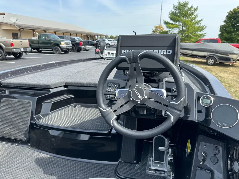 Slide: The Image of Steering wheel and dashboard of 2025 iKon VLX20 boat with Humminbird display. - 20