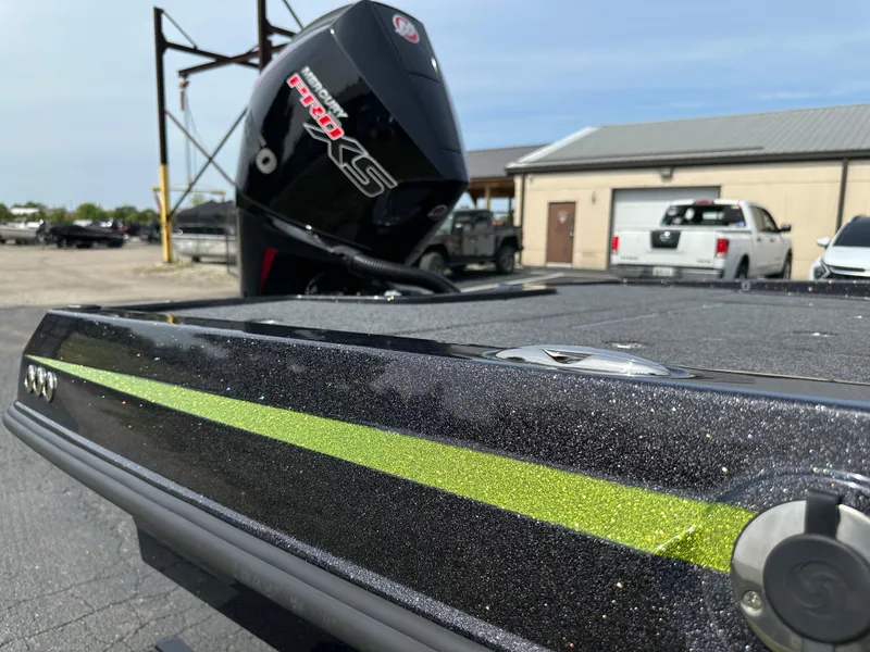 Slide: The Image of 2025 iKon VLX20 boat with sleek design and powerful outboard motor. - 22