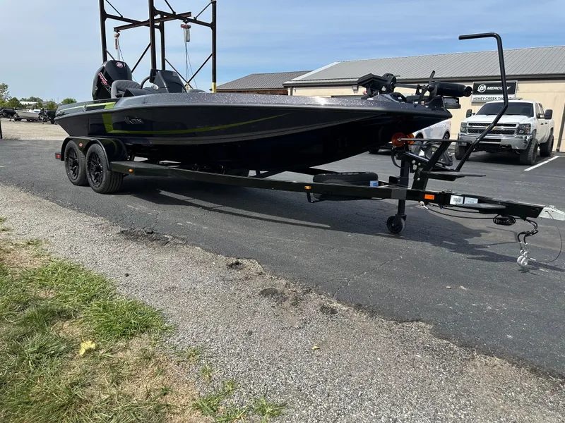 Slide: The Image of 2025 iKon VLX20 boat on trailer, parked outdoors near a building. - 4
