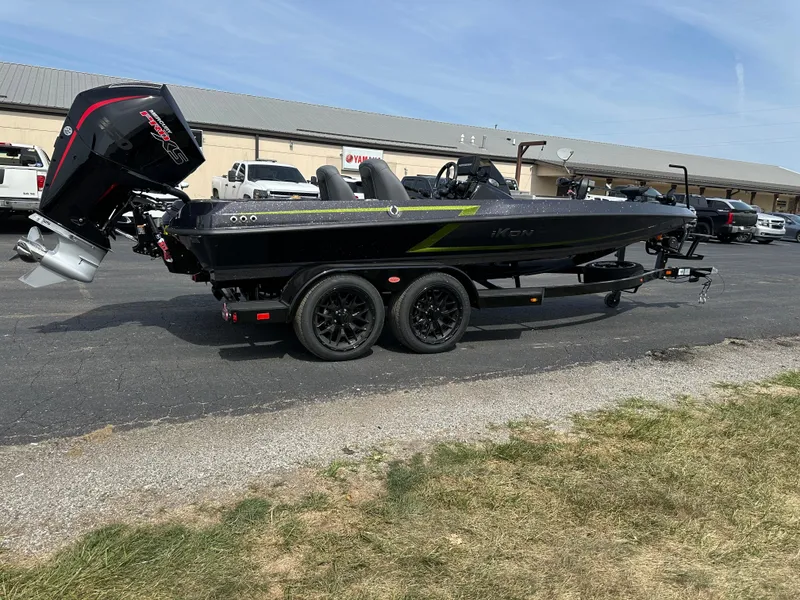 Slide: The Image of 2025 iKon VLX20 boat on trailer, black exterior, parked outdoors. - 6