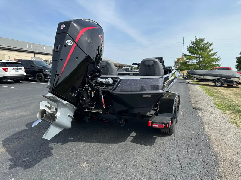 Slide: The Image of 2025 iKon VLX20 boat with powerful outboard motor in a parking lot. - 7