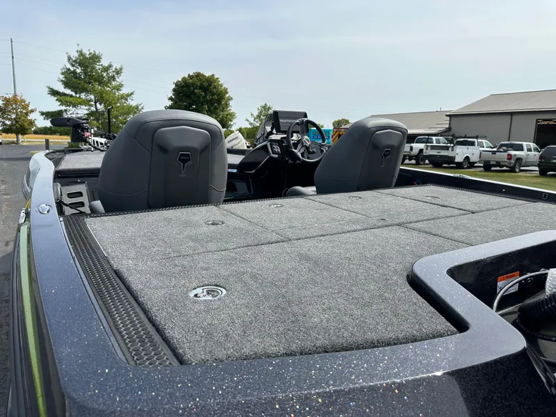 Slide: The Image of 2025 iKon VLX20 boat with spacious deck and dual seats in outdoor setting. - 9