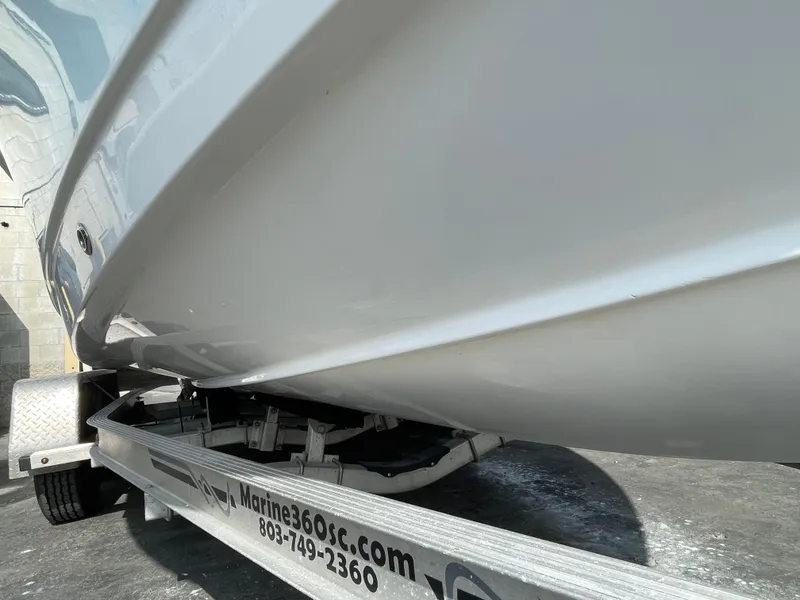 Slide: The Image of 2021 Sea Hunt Ultra 219 boat on trailer, side view. - 17