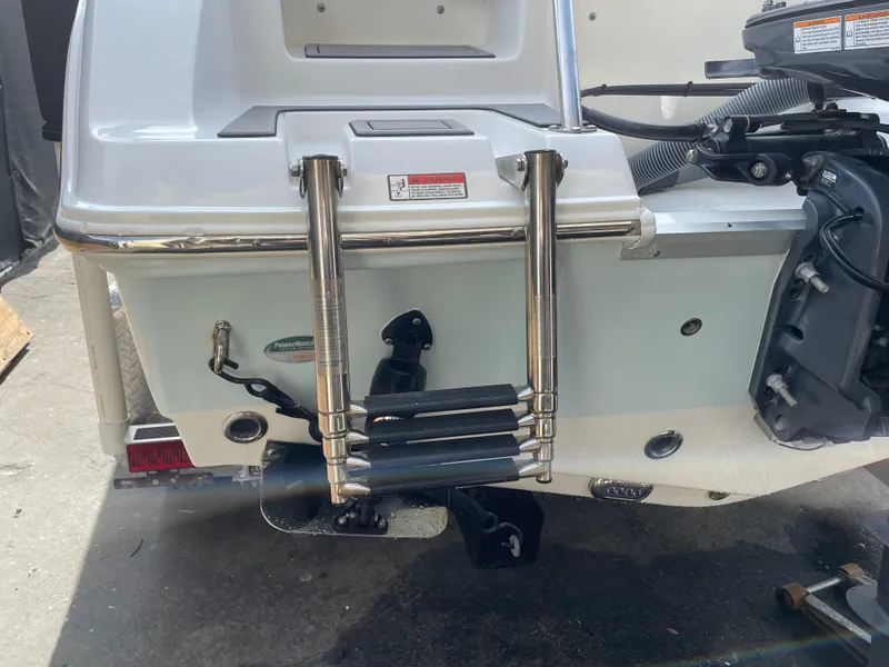 Slide: The Image of Rear view of 2021 Sea Hunt Ultra 219 boat with stainless steel ladder. - 20