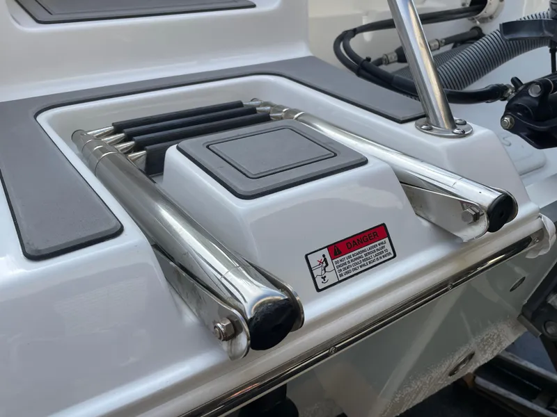 Slide: The Image of 2021 Sea Hunt Ultra 219 boat ladder and platform detail. - 26