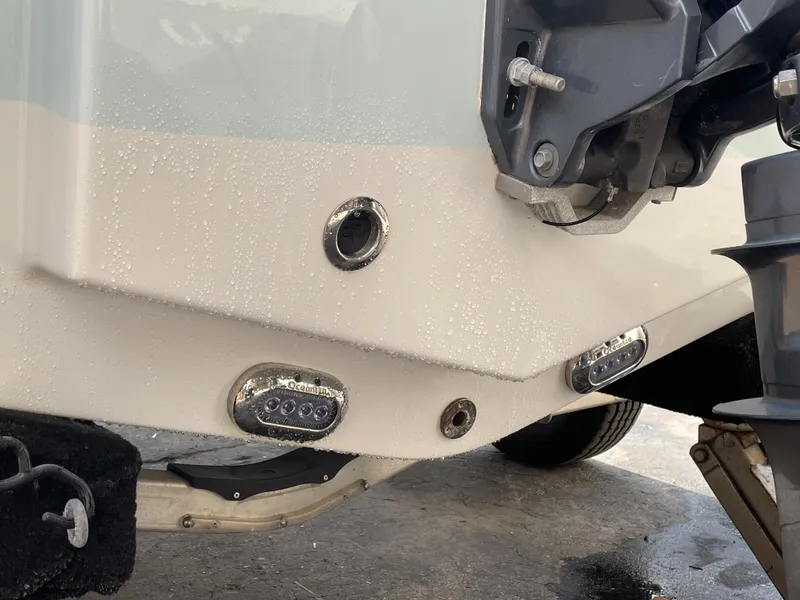 Slide: The Image of 2021 Sea Hunt Ultra 219 boat stern with underwater lights and motor mount. - 30