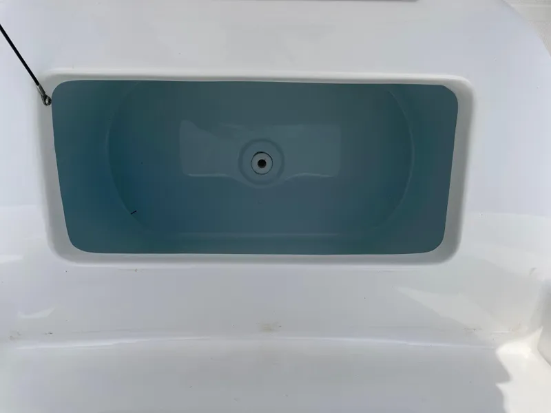 Slide: The Image of Livewell compartment on a 2021 Sea Hunt Ultra 219 boat. - 32