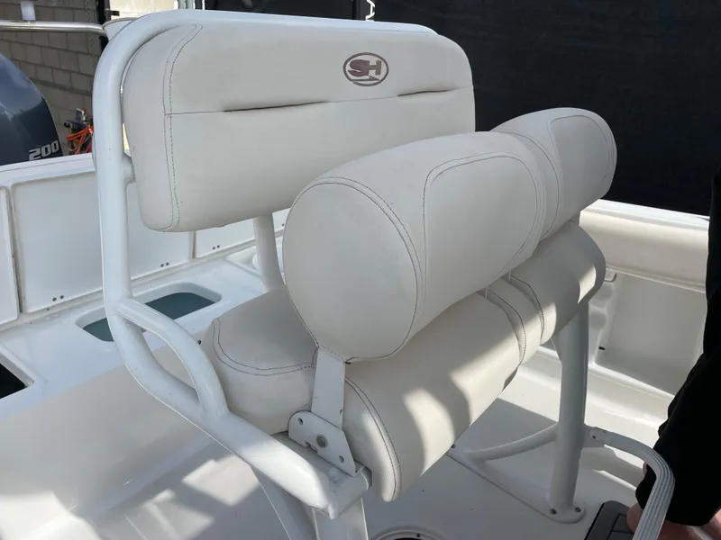 Slide: The Image of 2021 Sea Hunt Ultra 219 boat seat with white cushioned upholstery. - 34
