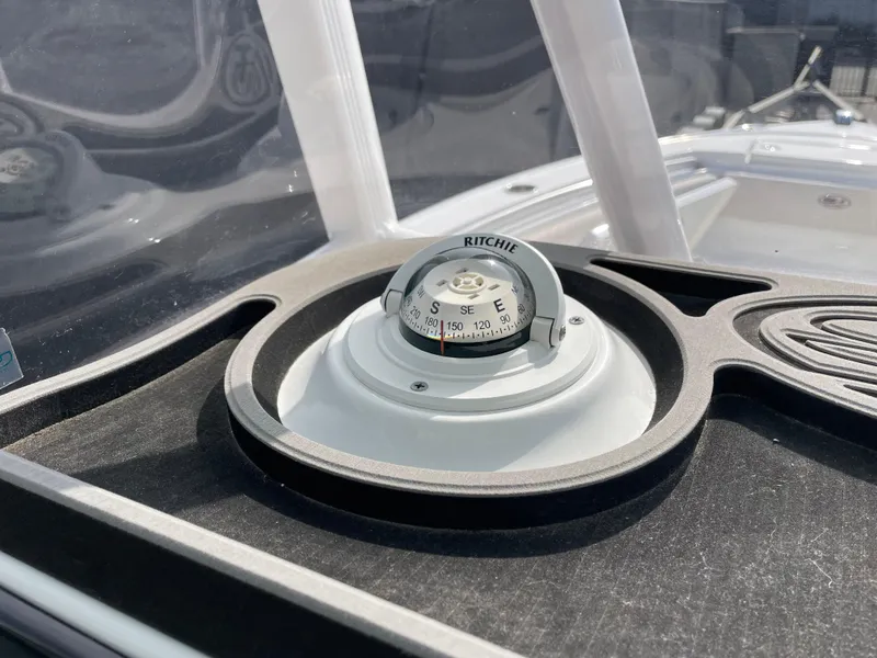 Slide: The Image of Compass on 2021 Sea Hunt Ultra 219 boat dashboard. - 35