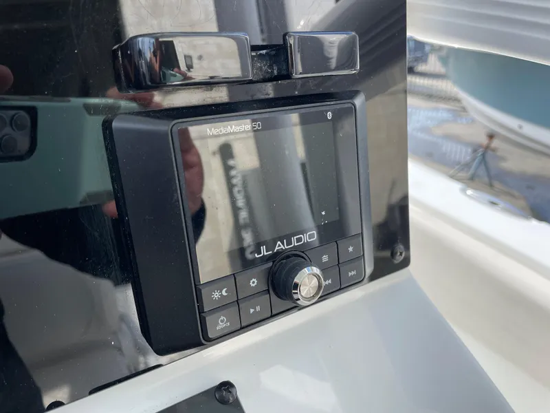 Slide: The Image of JL Audio system on 2021 Sea Hunt Ultra 219 boat dashboard. - 36