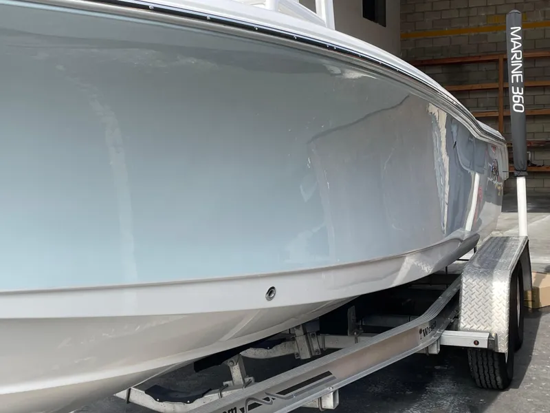 Slide: The Image of 2021 Sea Hunt Ultra 219 boat on trailer, side view. - 39