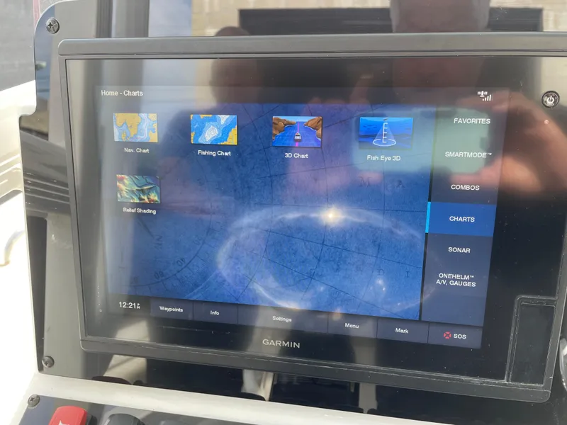 Slide: The Image of Garmin navigation display on 2021 Sea Hunt Ultra 219 boat, showing various chart options. - 40
