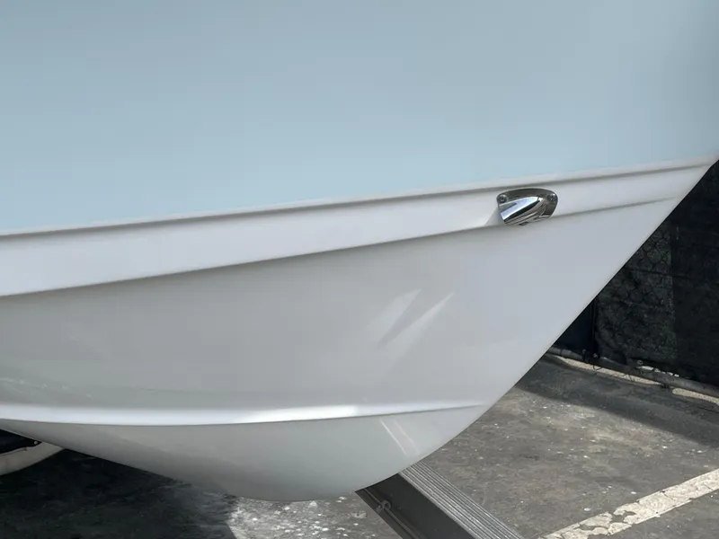 Slide: The Image of 2021 Sea Hunt Ultra 219 boat hull on trailer, close-up view. - 42