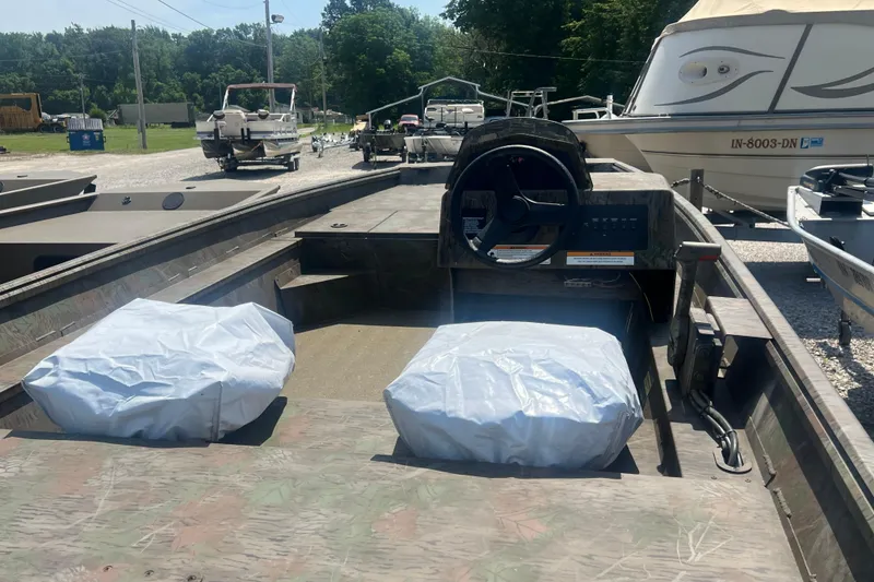 Slide: The Image of 2025 G3 Gator Tough 17 SC boat interior with storage compartments and seating. - 12