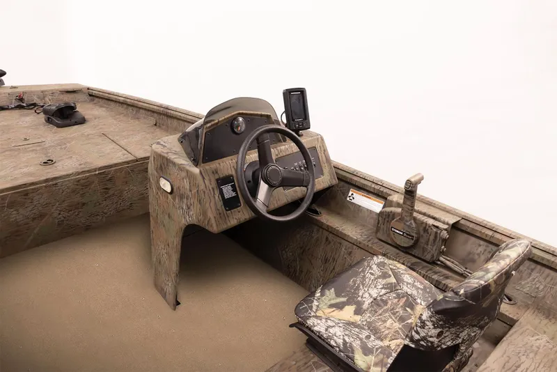 Slide: The Image of 2025 G3 Gator Tough 17 SC boat interior with covered seats and steering console. - 2