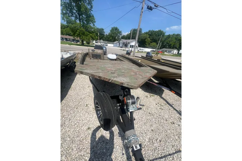 Slide: The Image of 2025 G3 Gator Tough 17 SC boat with Yamaha outboard motor in a gravel lot. - 6