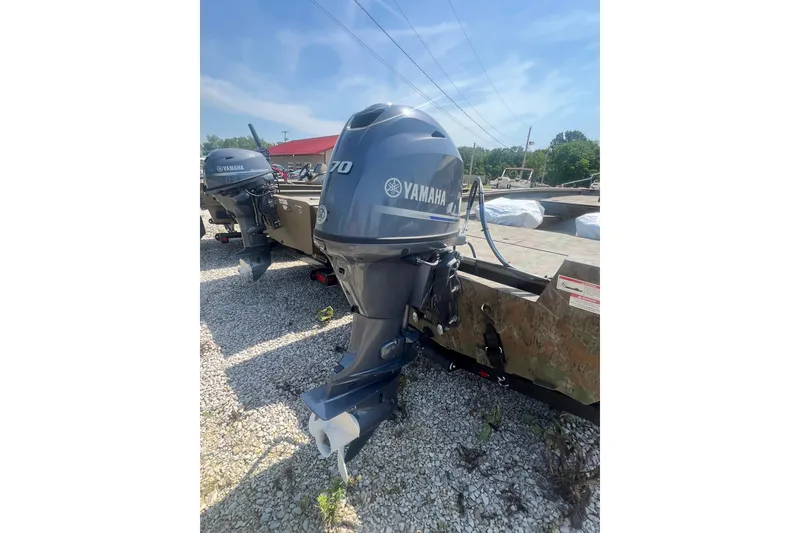 Slide: The Image of 2025 G3 Gator Tough 17 SC boat with camo design and outboard motor. - 7