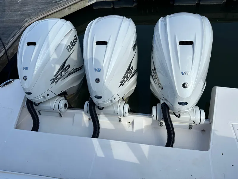 Slide: The Image of Triple Yamaha V8 outboard engines on a 2021 Regal 42 FXO boat. - 12