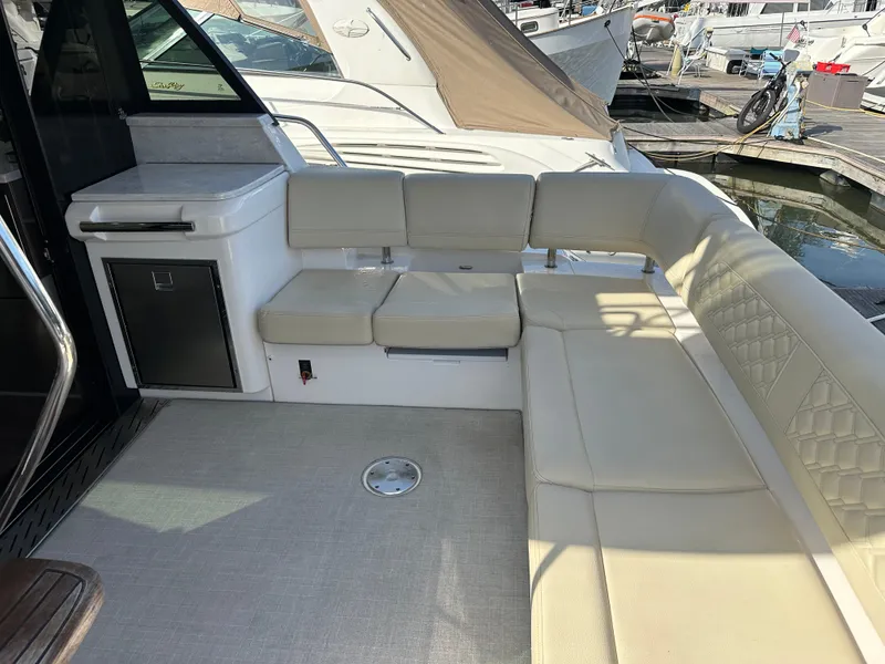 Slide: The Image of 2021 Regal 42 FXO yacht interior with beige seating and modern design. - 15
