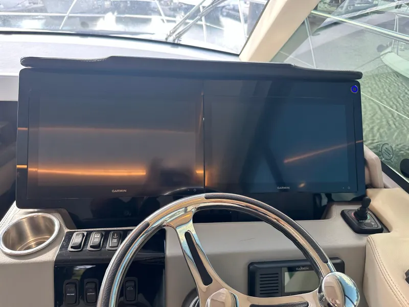 Slide: The Image of Dashboard of 2021 Regal 42 FXO yacht with dual Garmin displays. - 23