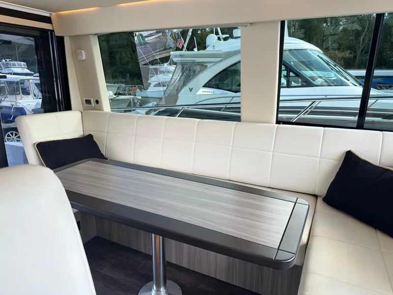Slide: The Image of Luxurious interior of 2021 Regal 42 FXO yacht with elegant seating and table. - 27