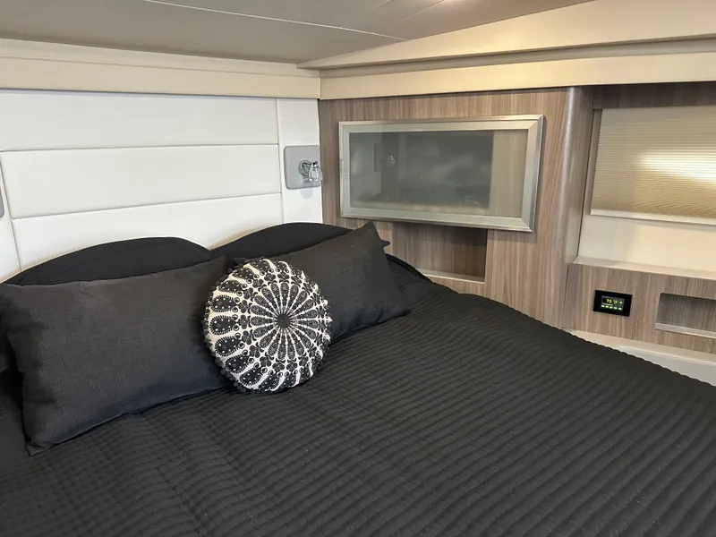 Slide: The Image of Luxurious cabin interior of 2021 Regal 42 FXO yacht with modern bedding. - 34