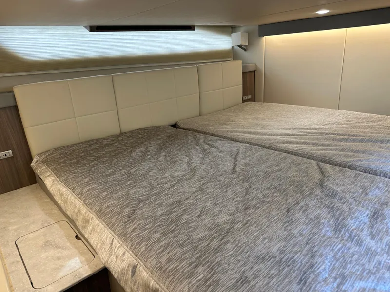 Slide: The Image of Interior cabin of 2021 Regal 42 FXO yacht with twin beds. - 43