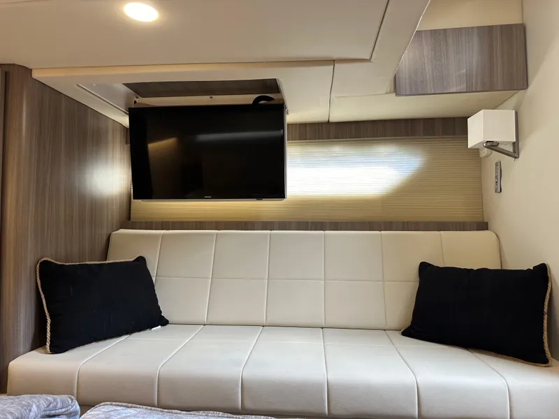 Slide: The Image of Interior of 2021 Regal 42 FXO yacht with modern sofa and wall-mounted TV. - 46