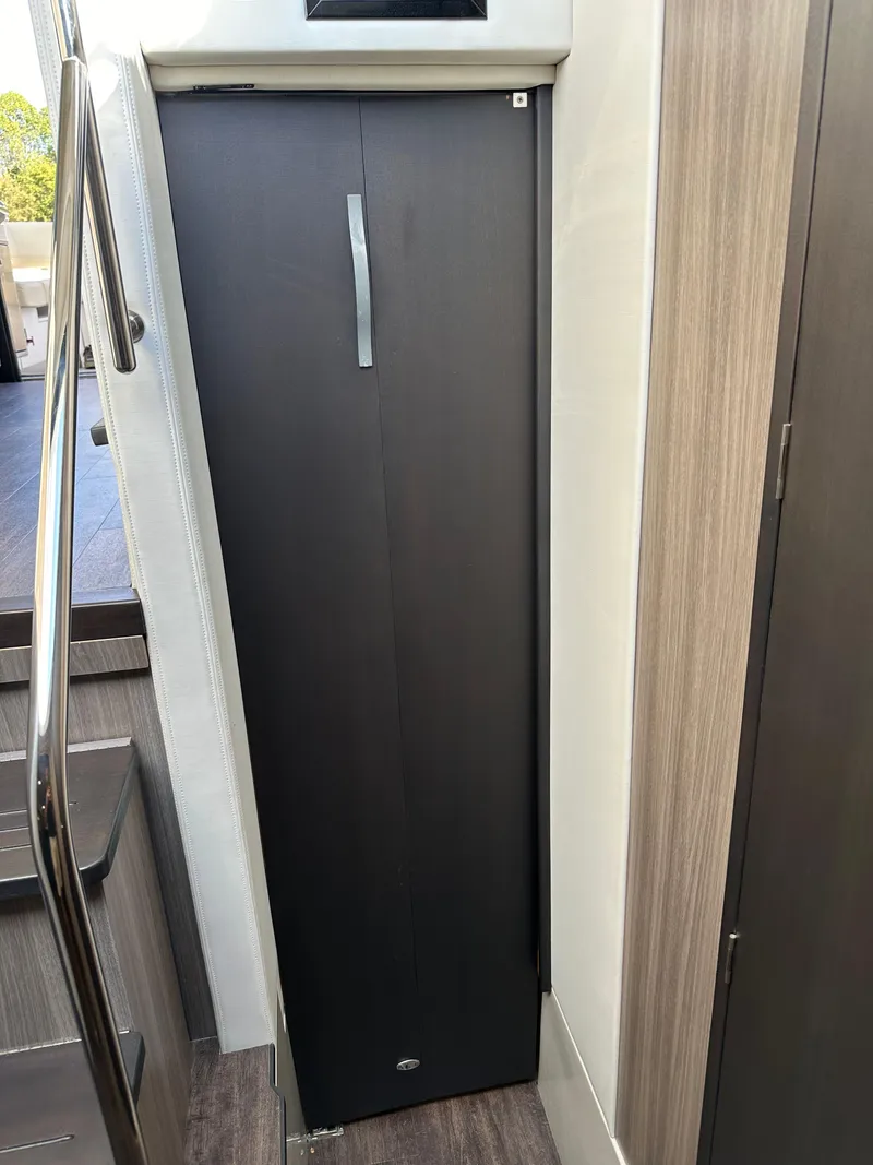 Slide: The Image of 2021 Regal 42 FXO interior with sleek, modern cabinetry and elegant design. - 48