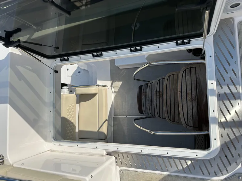 Slide: The Image of 2021 Regal 42 FXO boat interior with seating and steps. - 49