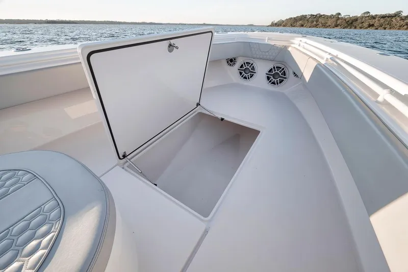 Slide: The Image of 2021 Contender 44 ST boat with open storage compartment on deck. - 22