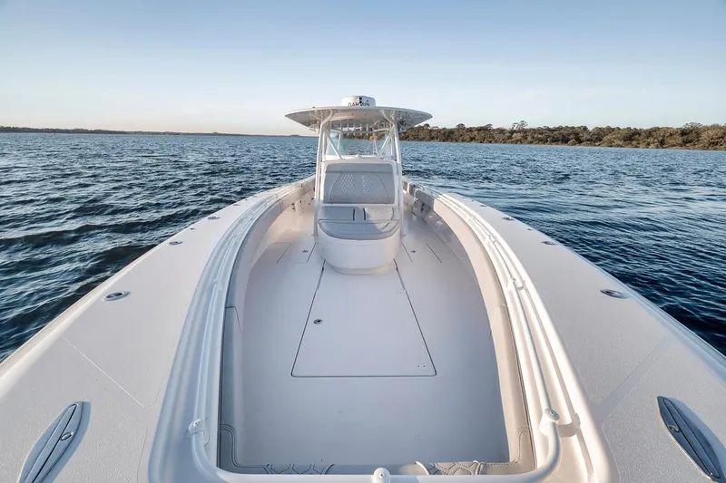 Slide: The Image of 2021 Contender 44 ST boat on open water, showcasing sleek design and spacious deck. - 24