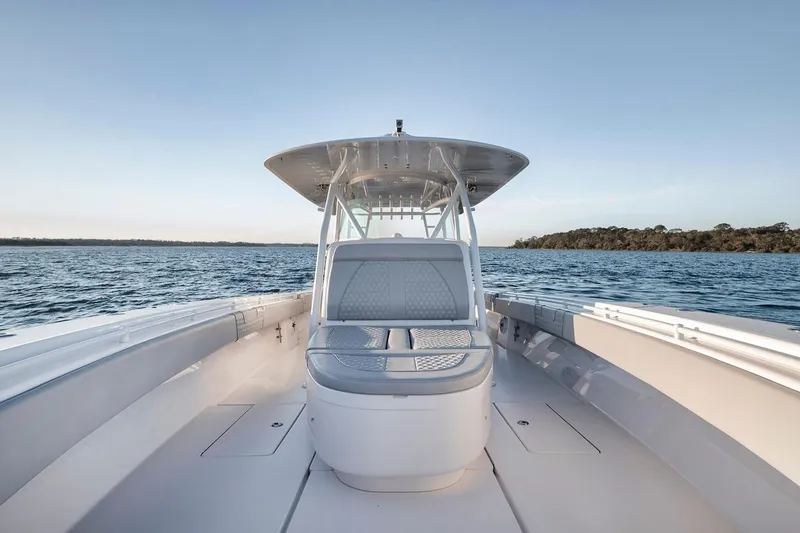 Slide: The Image of 2021 Contender 44 ST boat on open water, showcasing sleek design and spacious deck. - 25