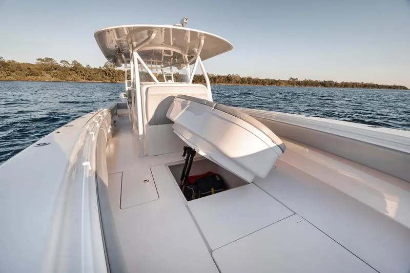 Slide: The Image of 2021 Contender 44 ST boat on water, showcasing spacious deck and seating. - 26